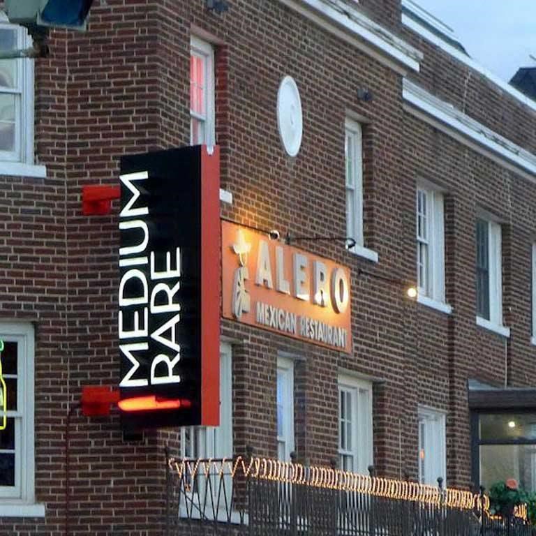 a sign on the side of a brick building