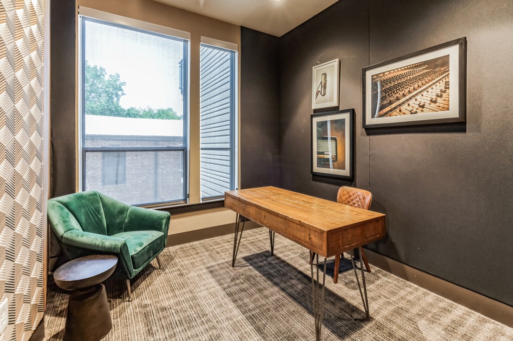 a conference room with a green chair and a wooden table