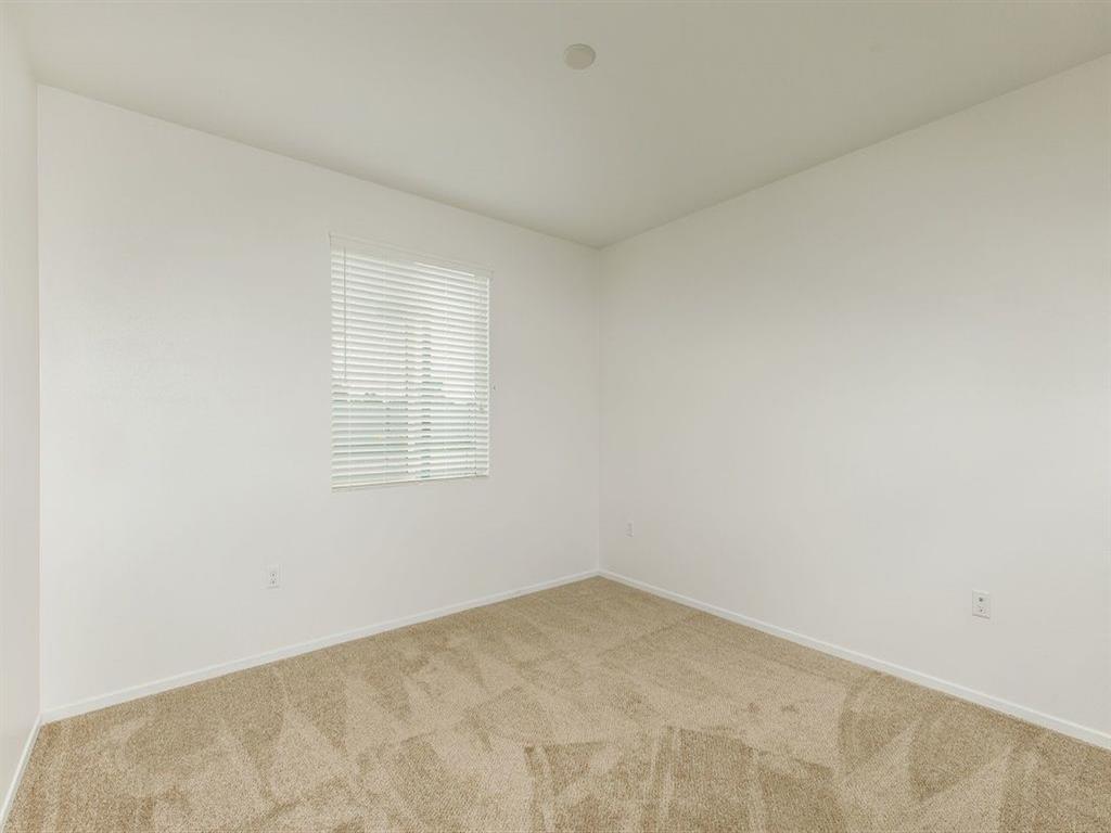 2nd bedroom with a lot of space with window