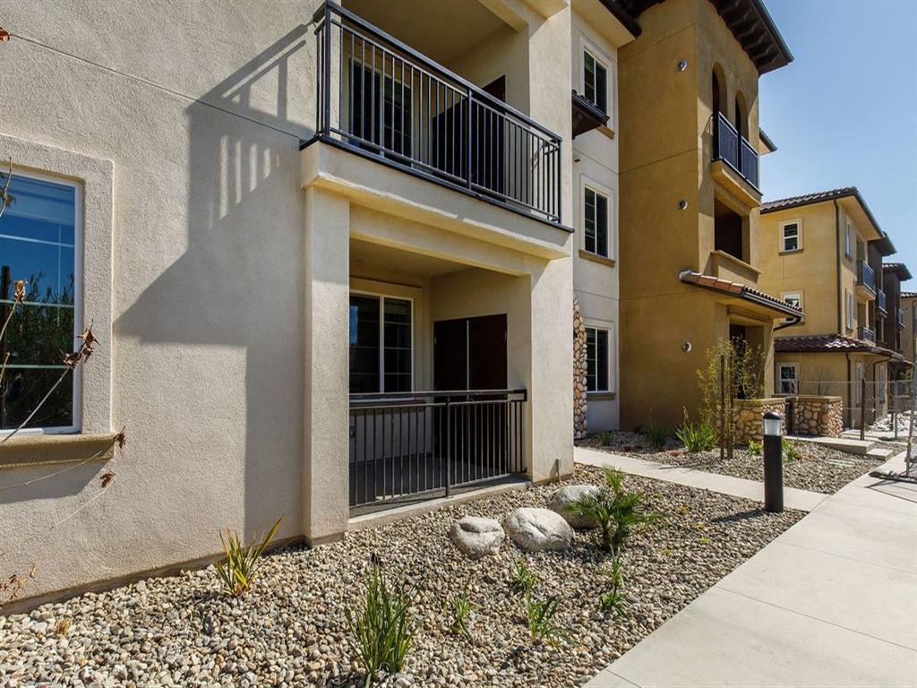 Outside apartment are rocks and plants