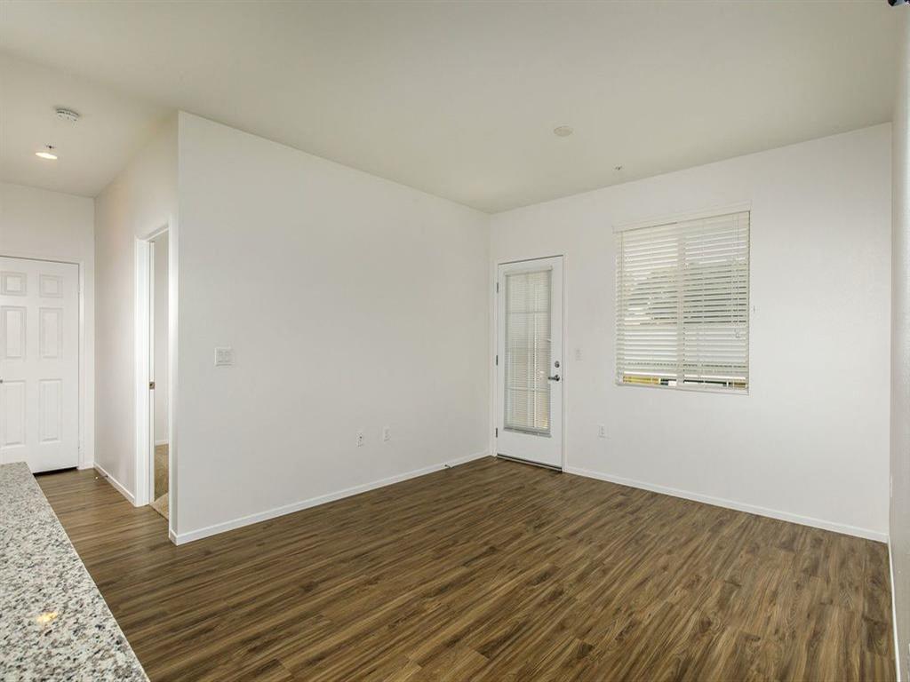 Patio door with a window on the side and spacious living room