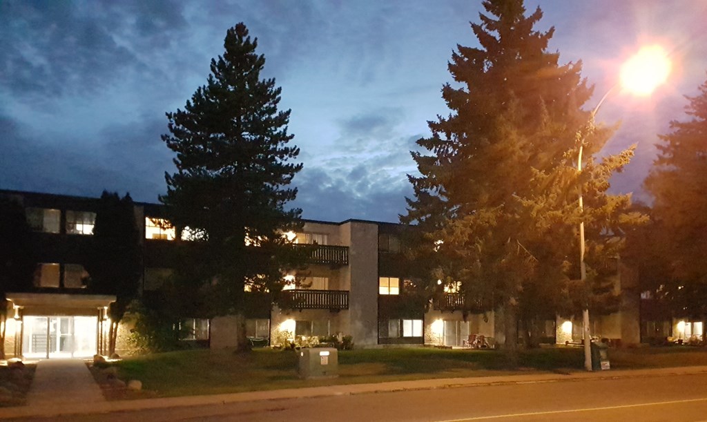 the building where the motel is located is lit up at night