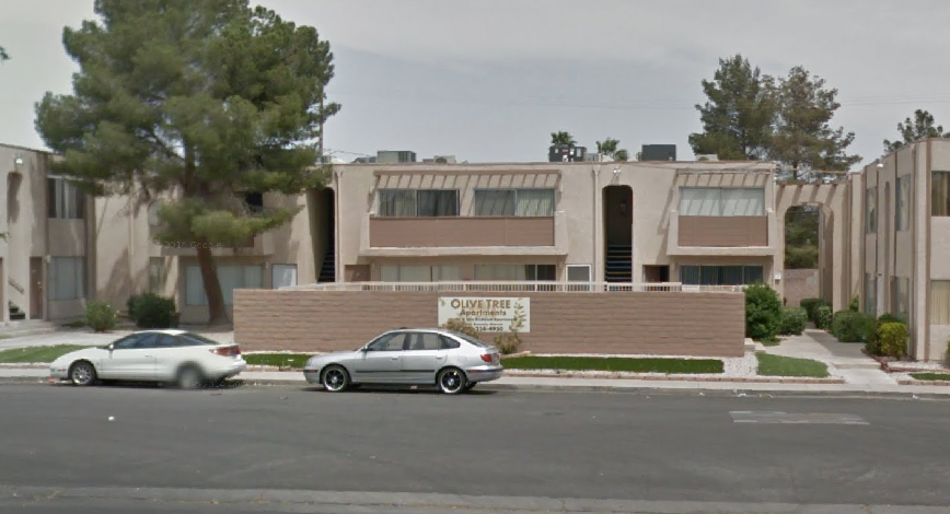 a building is shown with cars parked in front of it