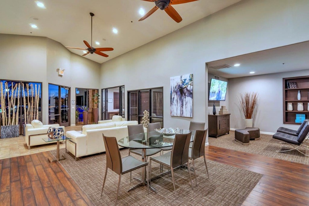 a living room with a table and chairs and a couch
