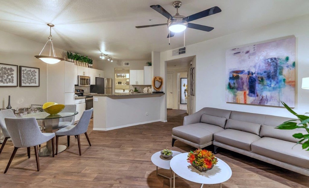 a living room and dining room with a couch and a table