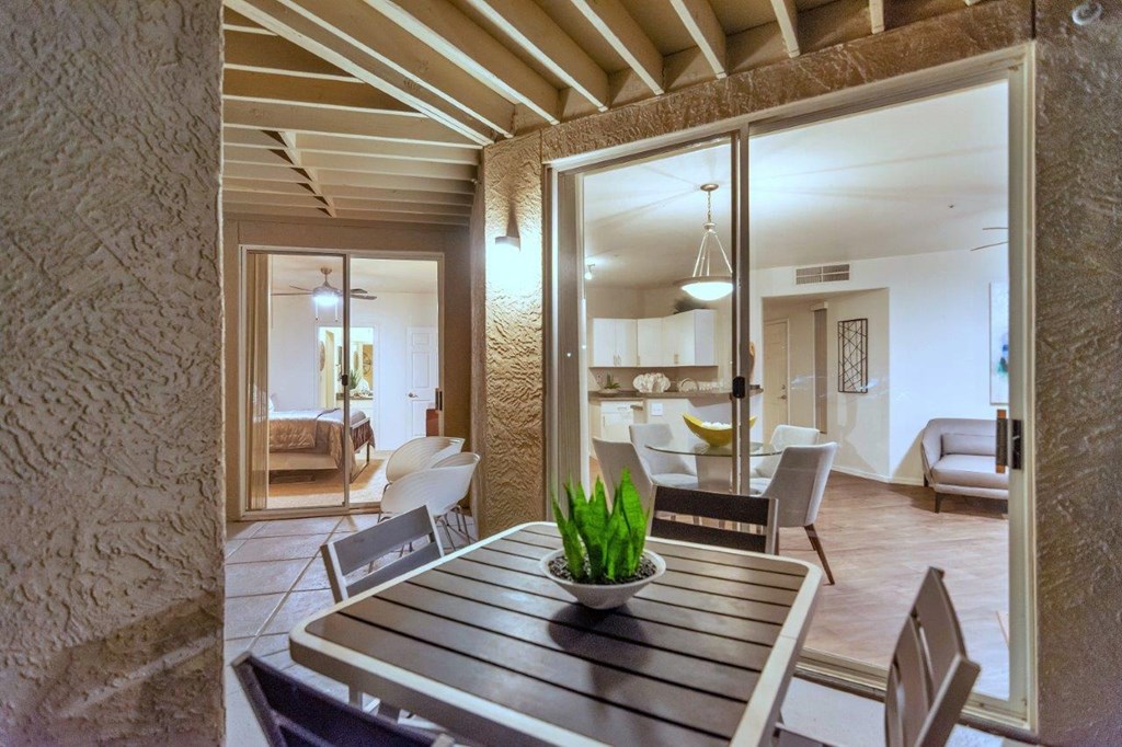 a dining room table with a potted plant on top of it