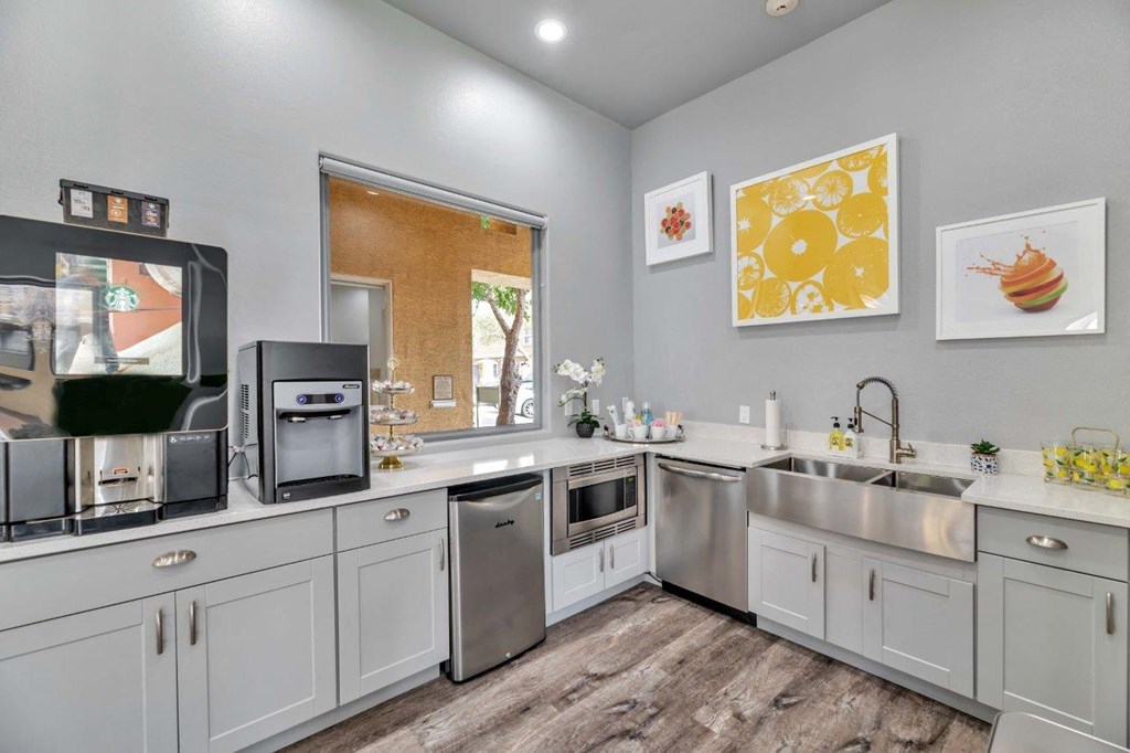 a kitchen with stainless steel appliances and a window