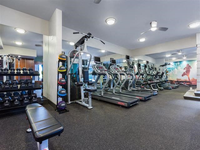 a gym with a bunch of exercise equipment in it