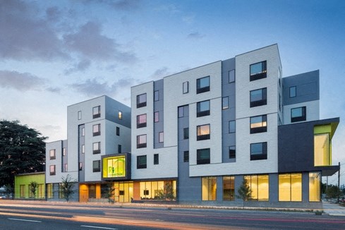 a rendering of a building on a city street