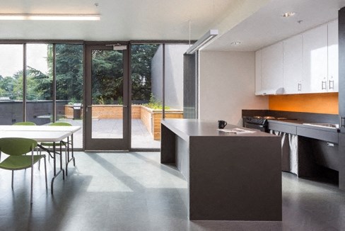 a kitchen with an island and a table with chairs