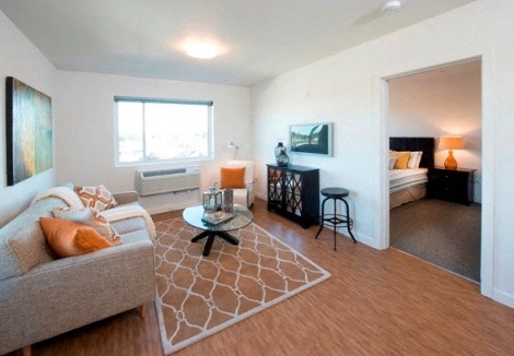 a living room with a couch and a table