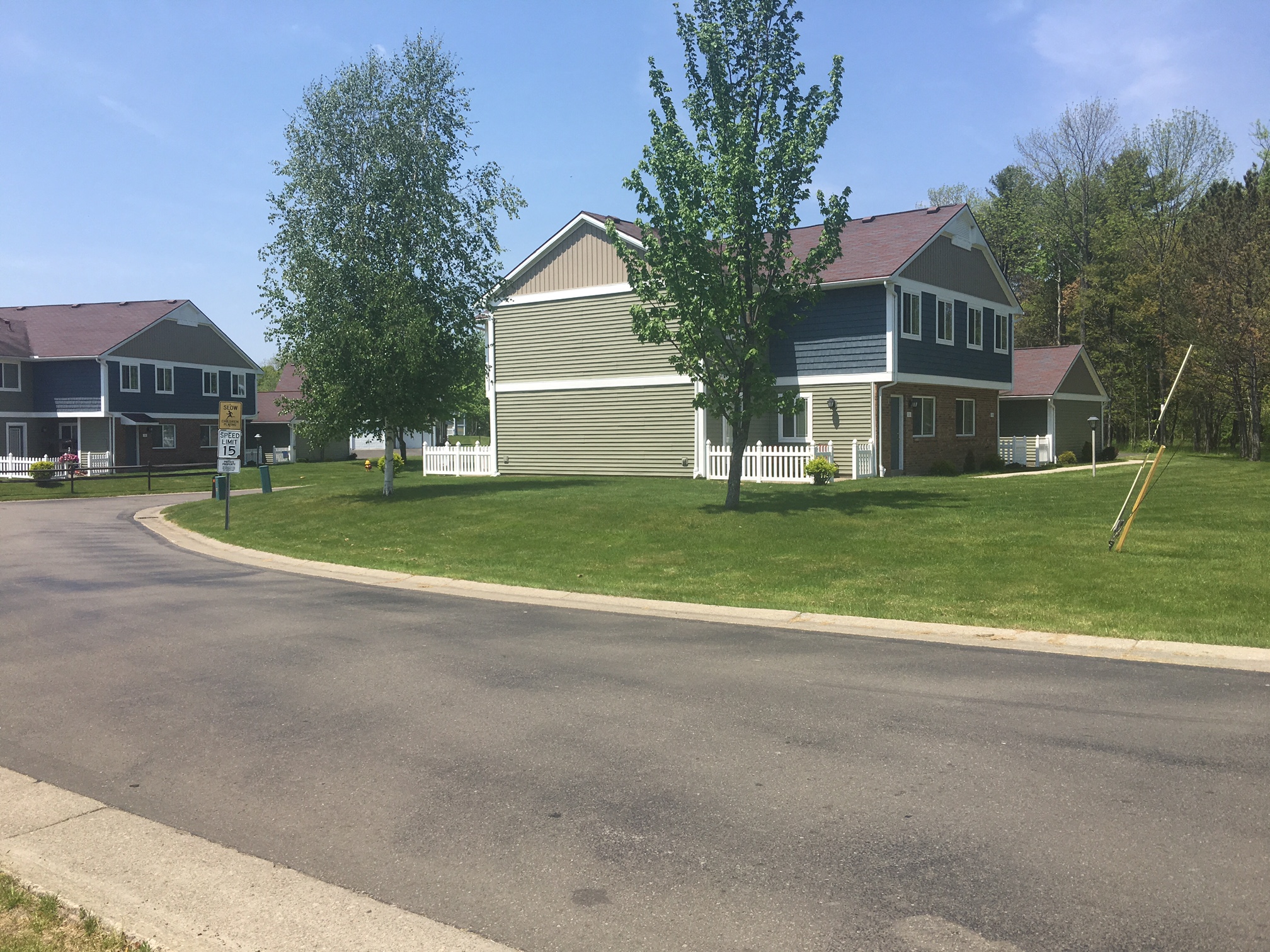 a neighborhood with houses on the corner of a street