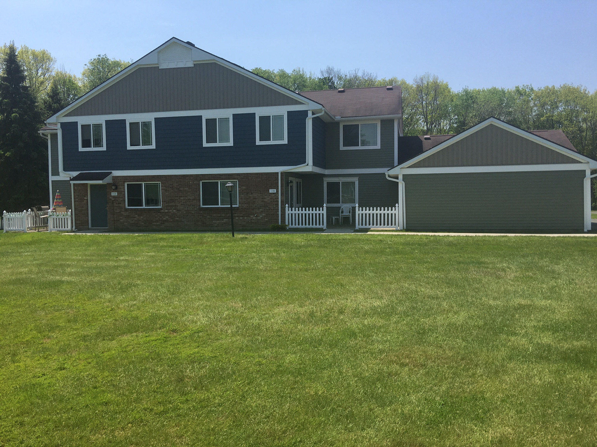 a large house with a lawn in front of it