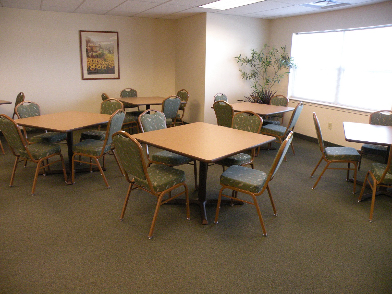 a dining room with tables and chairs