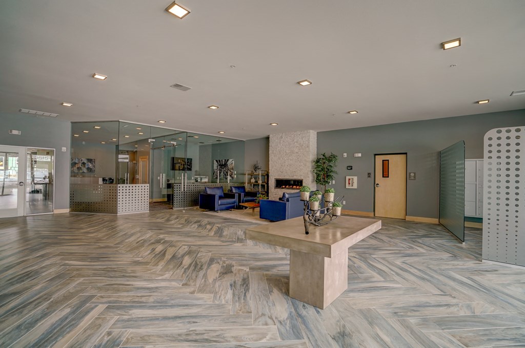 a large lobby with a marble floor and a table