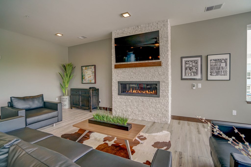 a living room with a fireplace and couches