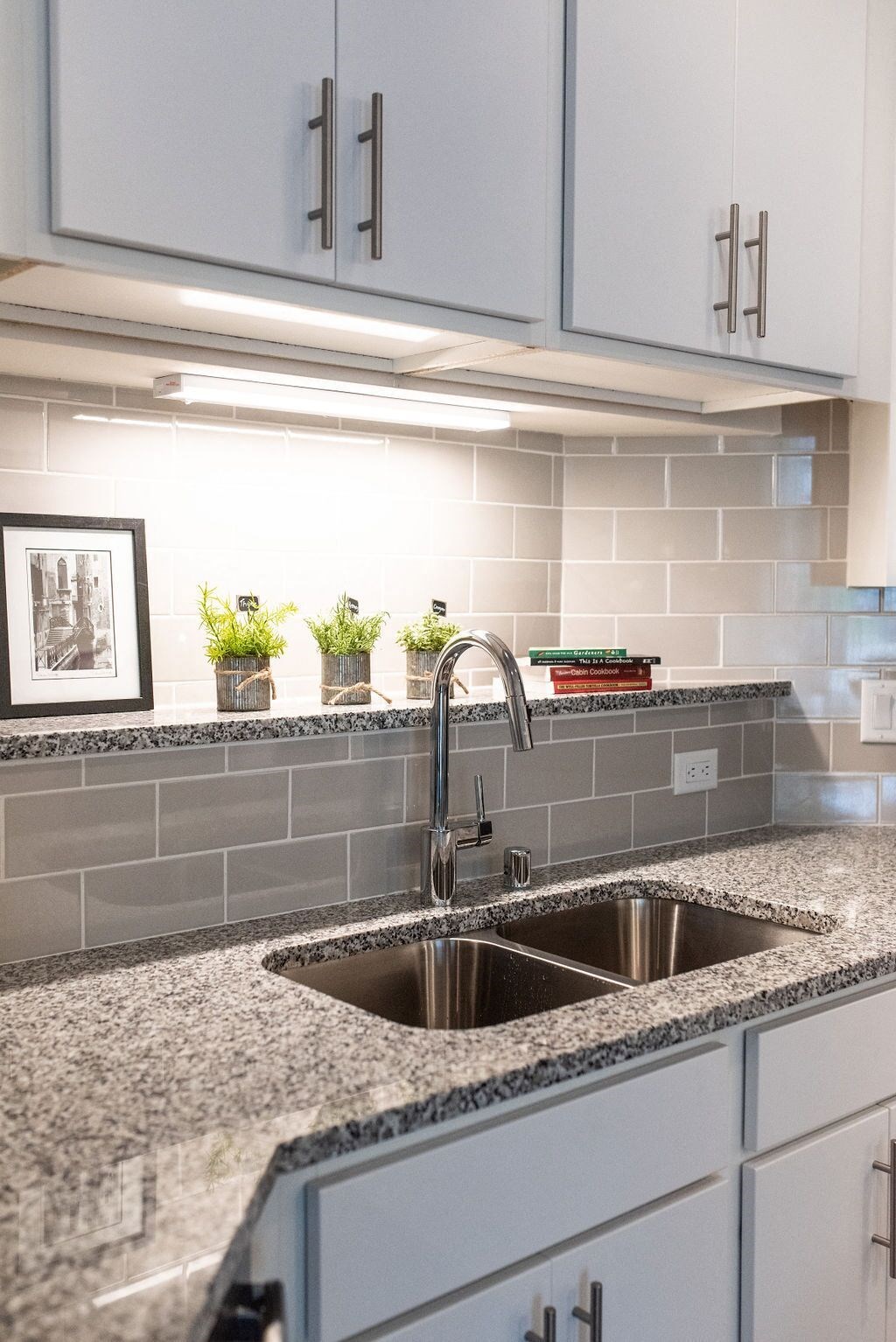 a kitchen with a sink and a counter top