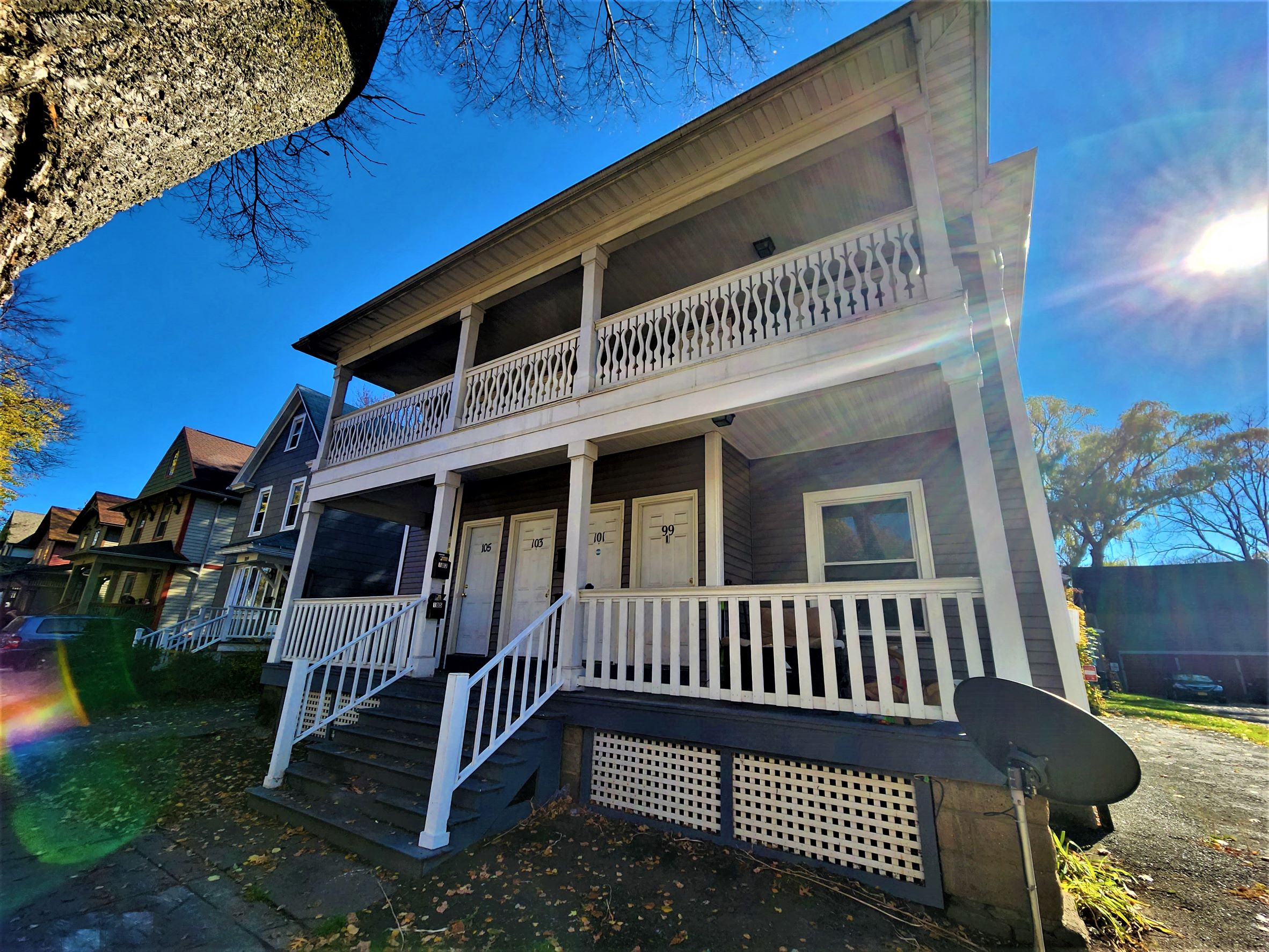 a house with a porch and a surfboard on the front