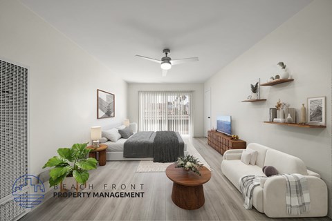 A living room with a couch, a bed, and a coffee table.