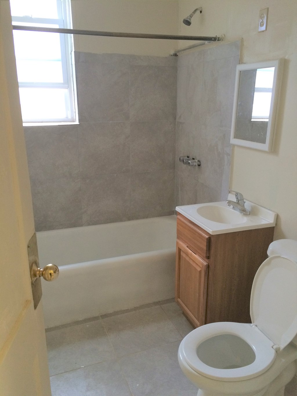 an empty bathroom with a toilet and a sink