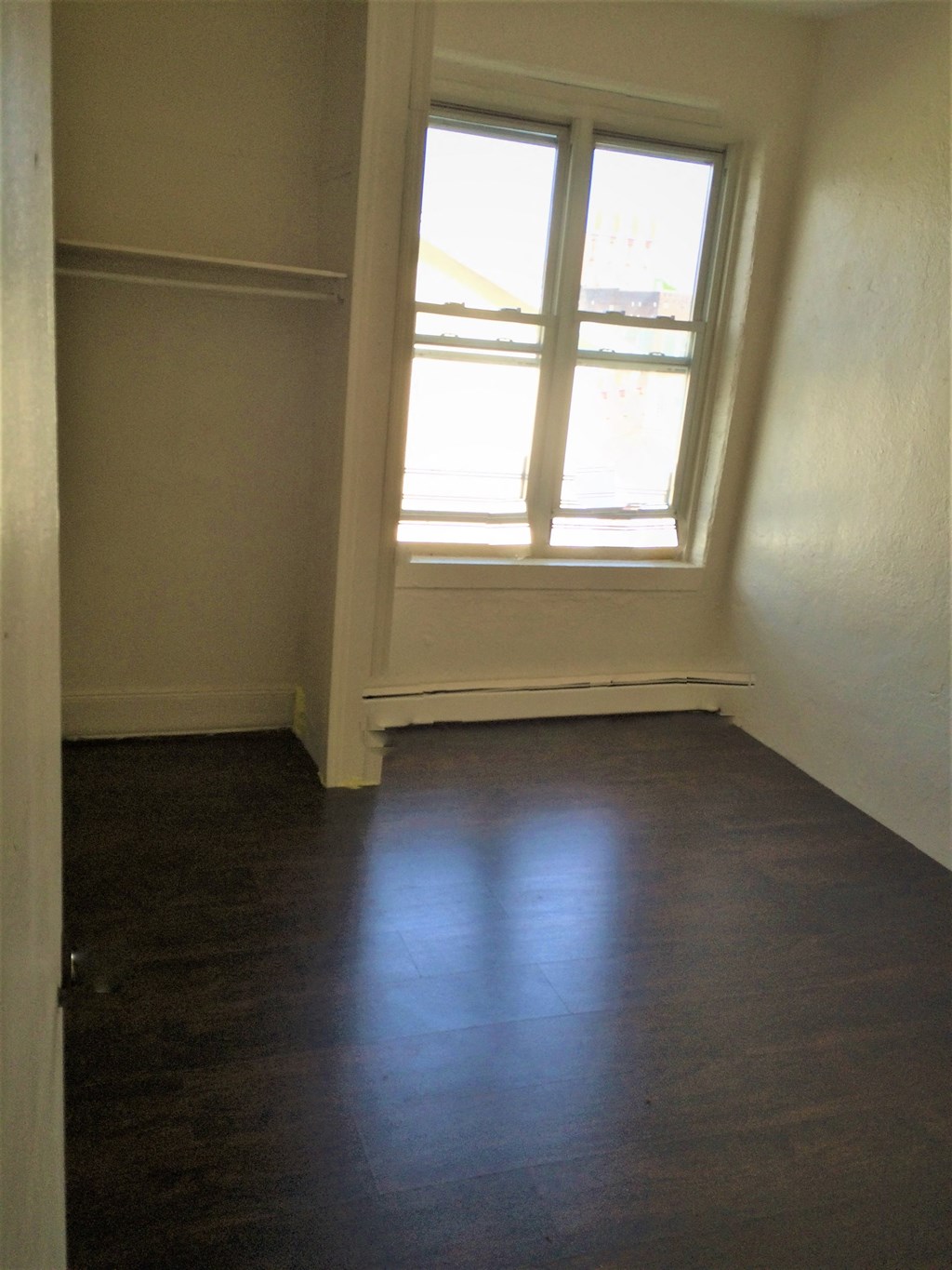 an empty room in a house with a window