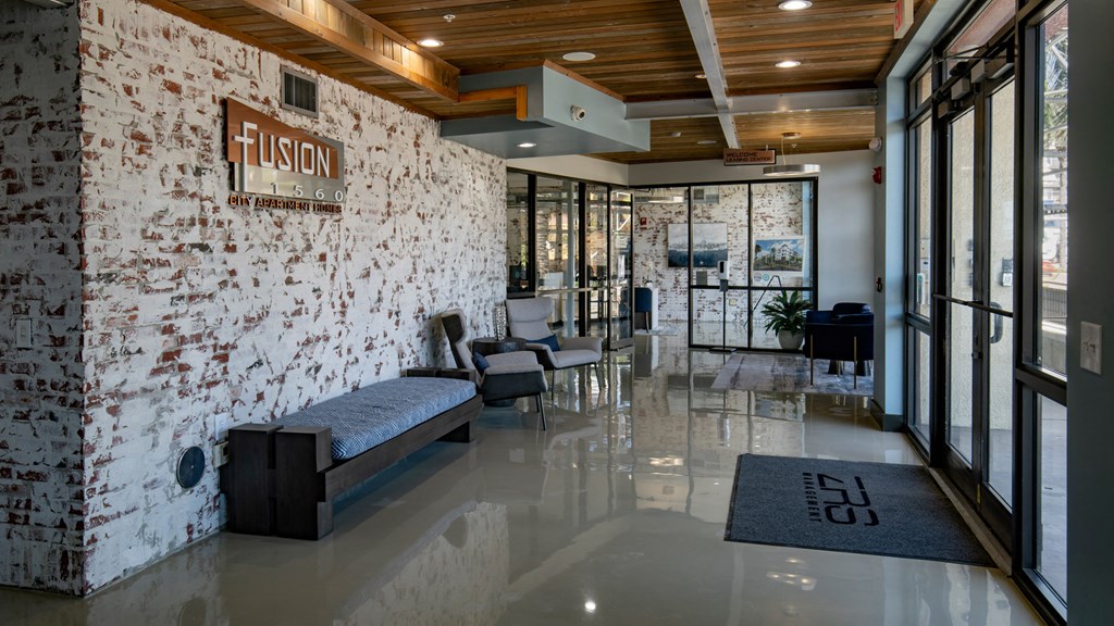 A white brick wall with a wooden ceiling and a sign that says "FUSION".