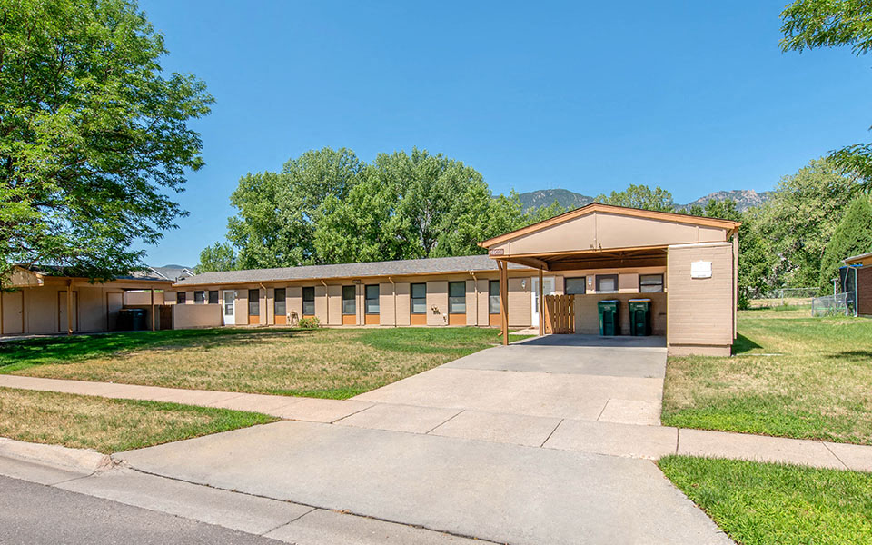 a building with a sidewalk in front of it