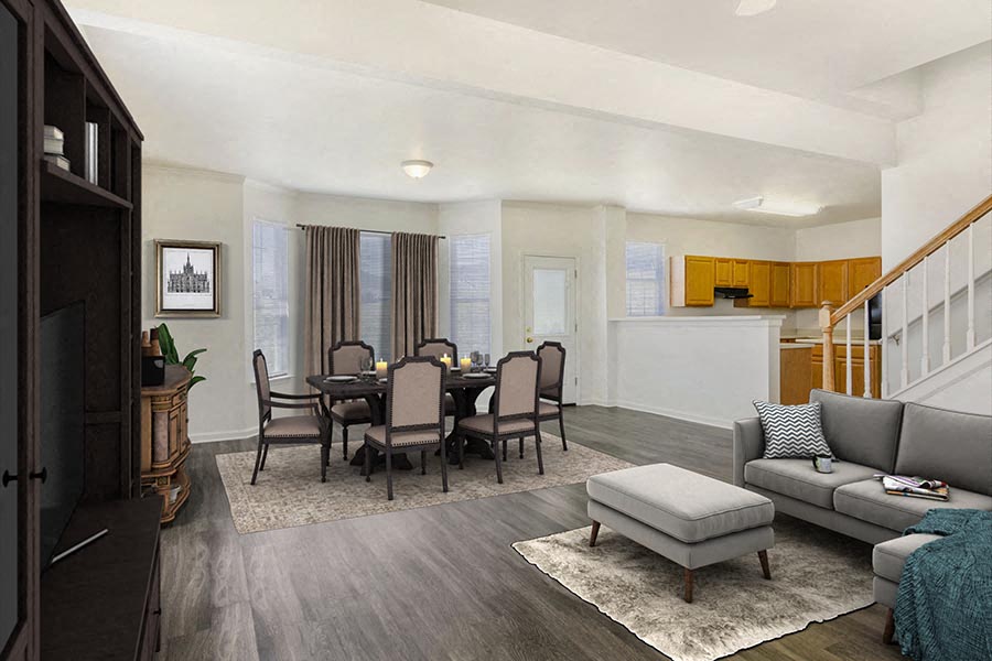 a living room and dining room with a table and chairs