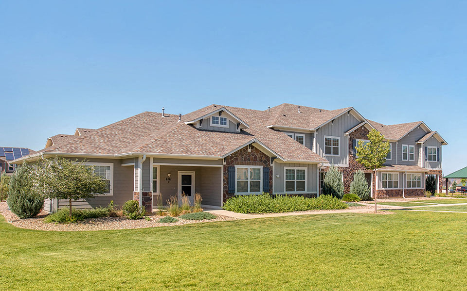 a large house with a lawn in front of it