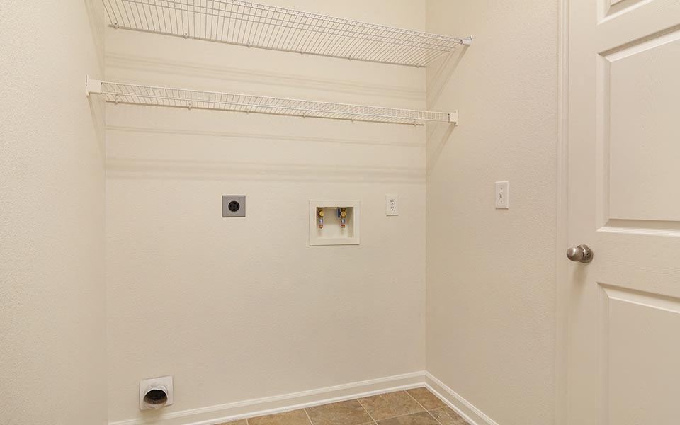 a bathroom with a closet and a white door