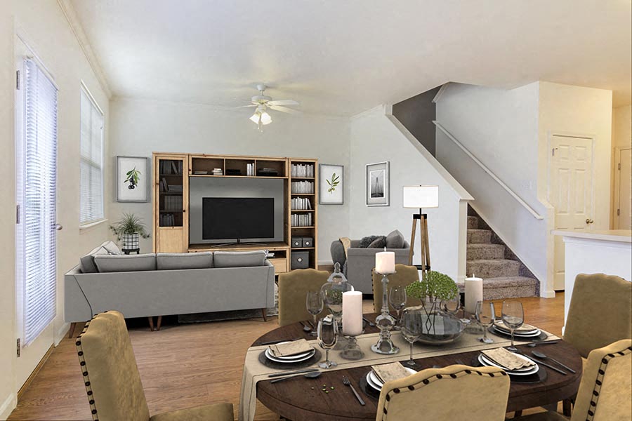 a living room with a table and a couch and a tv