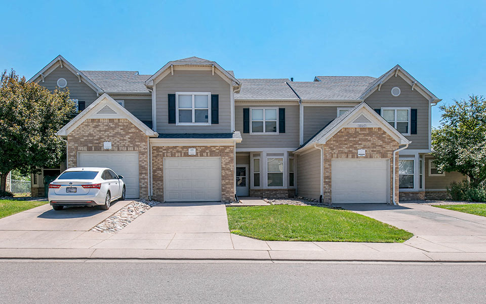 a large house with a car parked in front of it