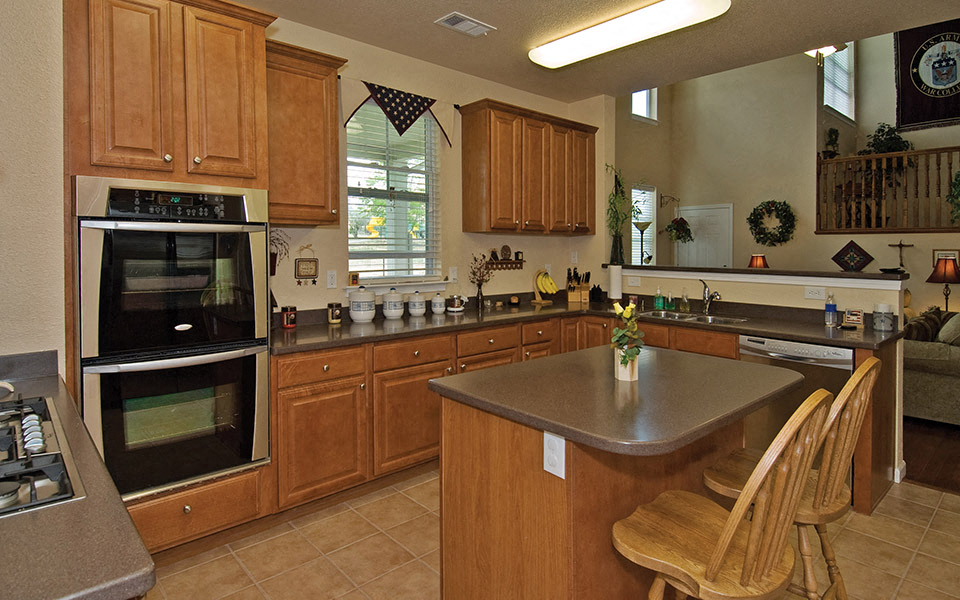 a kitchen with wooden cabinets and a counter top
