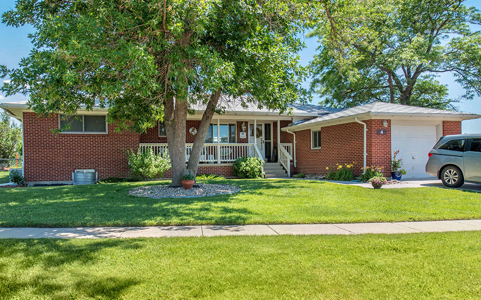 a house with a car parked in front of it