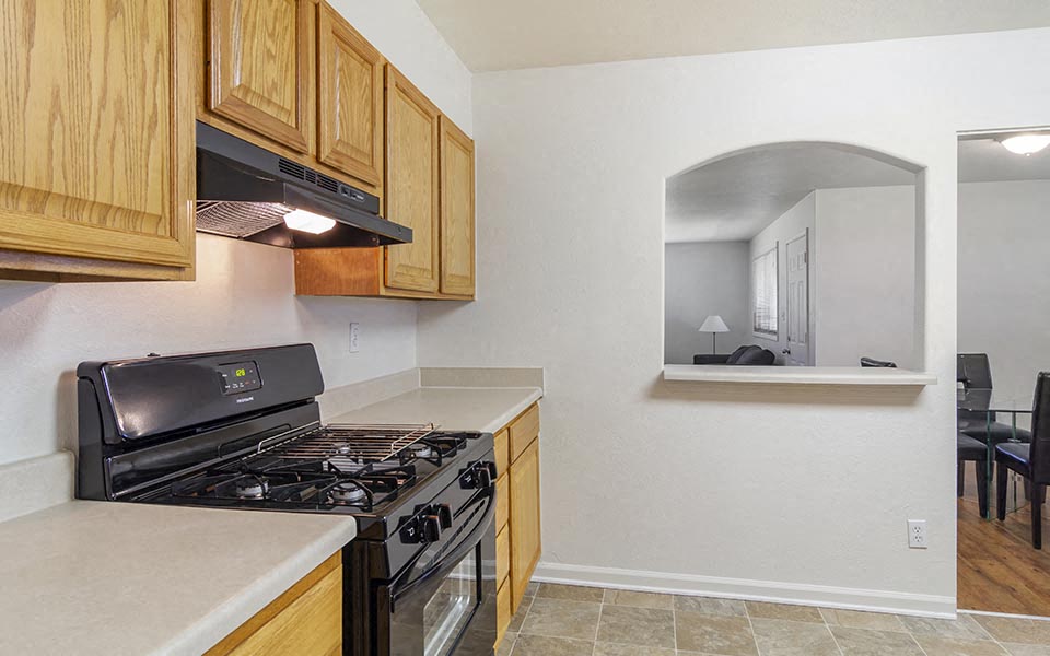a kitchen with a stove and a microwave