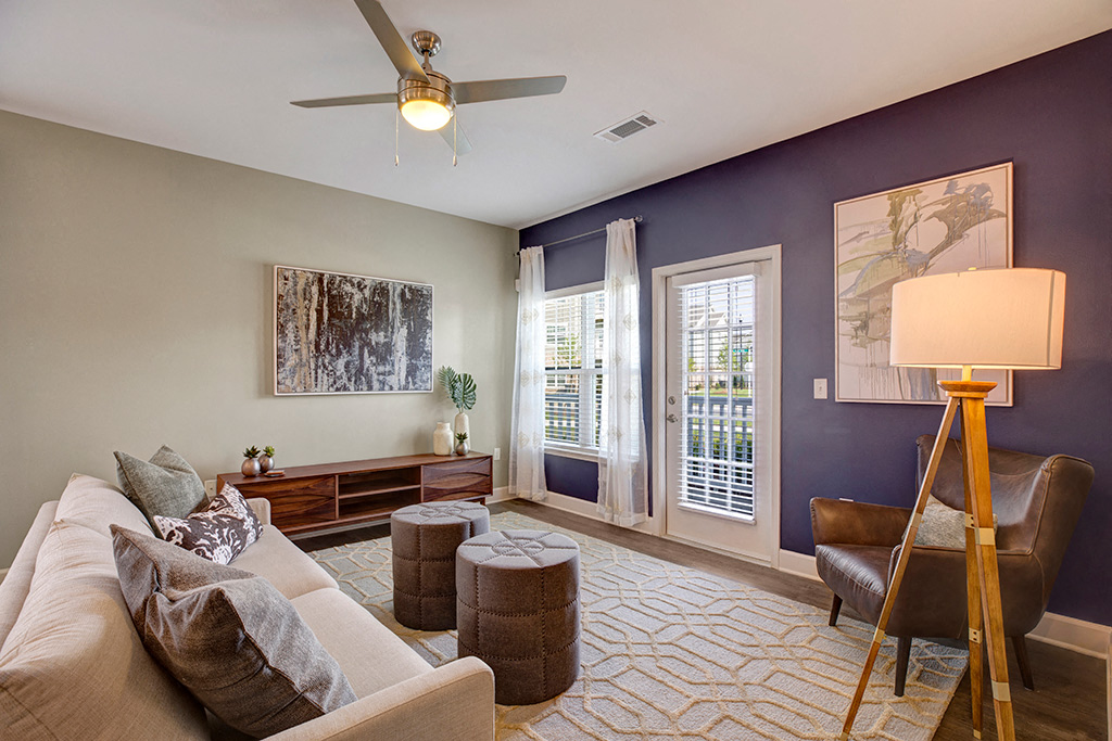 Living room area with tables, couches, chair at Ascent at Mallard Creek Charlotte, NC