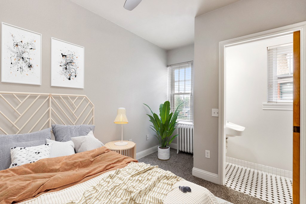 a bedroom with a bed and a window