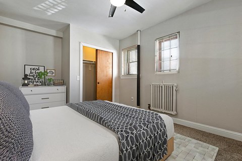 a bedroom with a bed and a closet