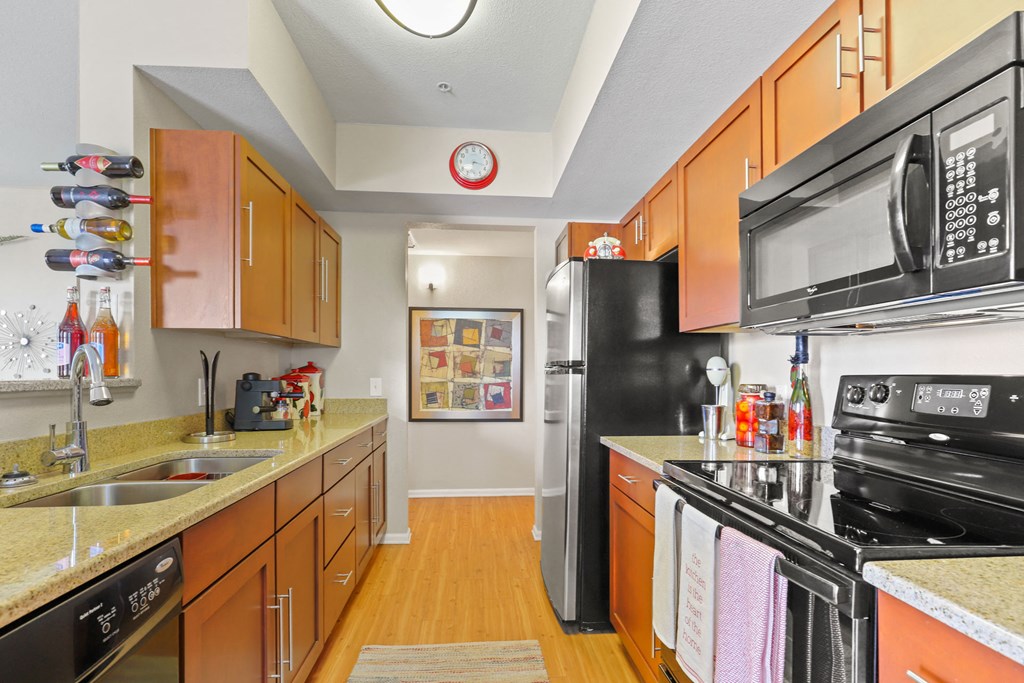 a kitchen with stainless steel appliances and granite counter tops