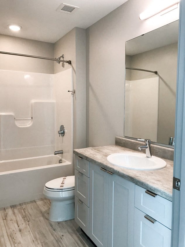 a bathroom with a sink toilet and a shower