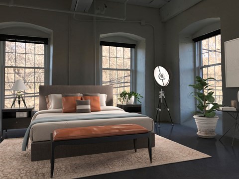 A bedroom with a large bed and a window.