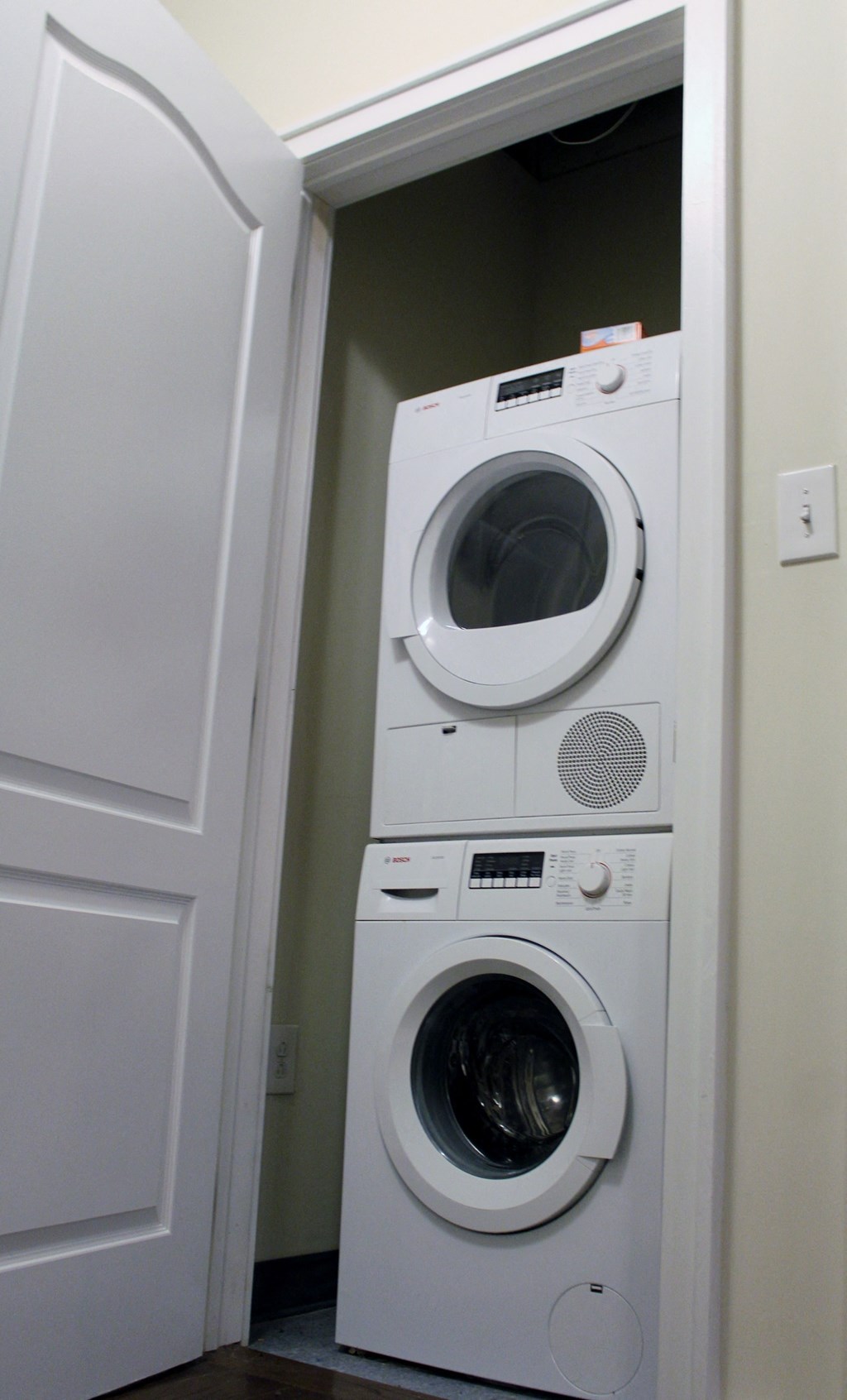 a front loading washer and dryer in a laundry closet