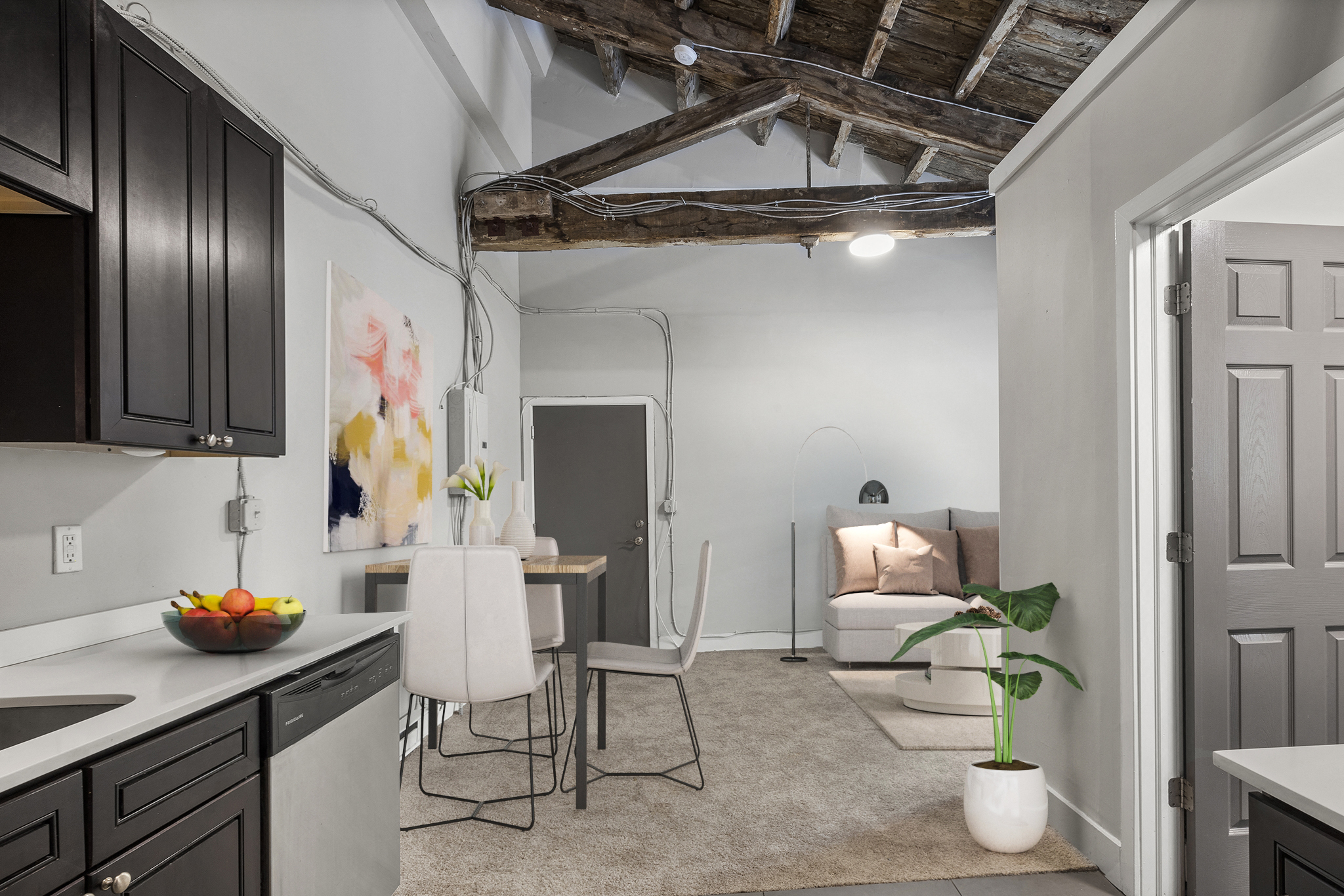 A kitchen with a table and chairs in the middle of the room.