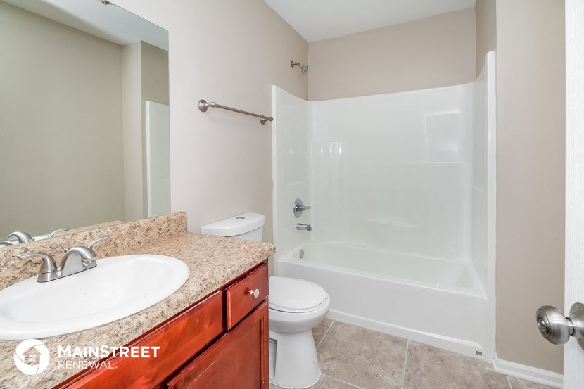 a bathroom with a sink toilet and a shower
