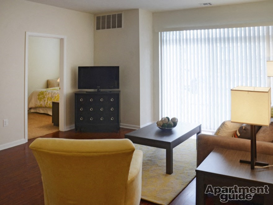 a living room with a couch and a table and a television