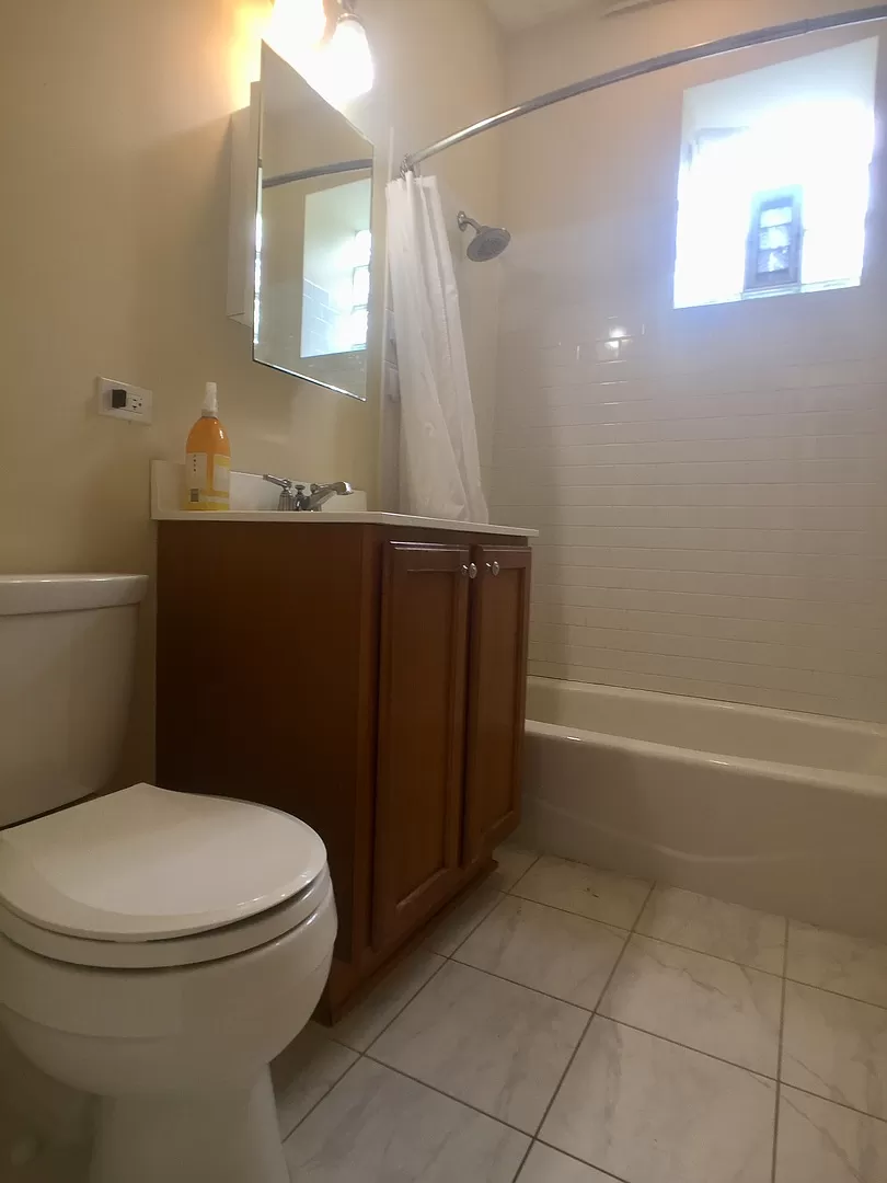 a bathroom with a toilet and a sink