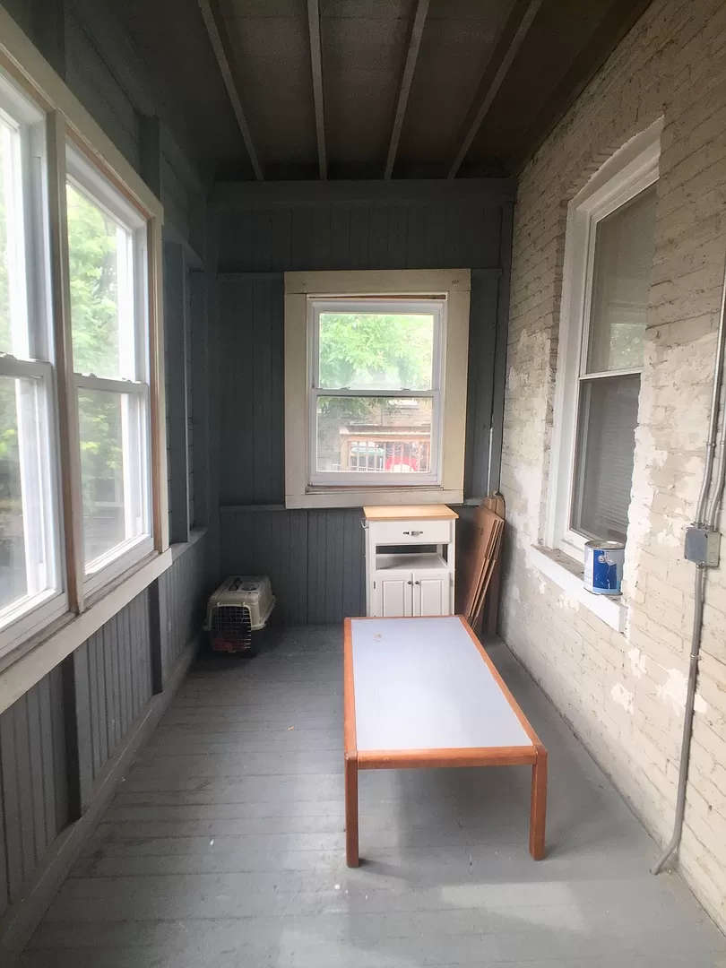 a small room with a table and a window