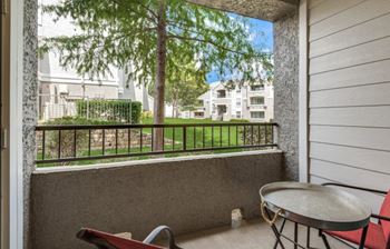 private patio with balcony at Kensley Apartment Homes
