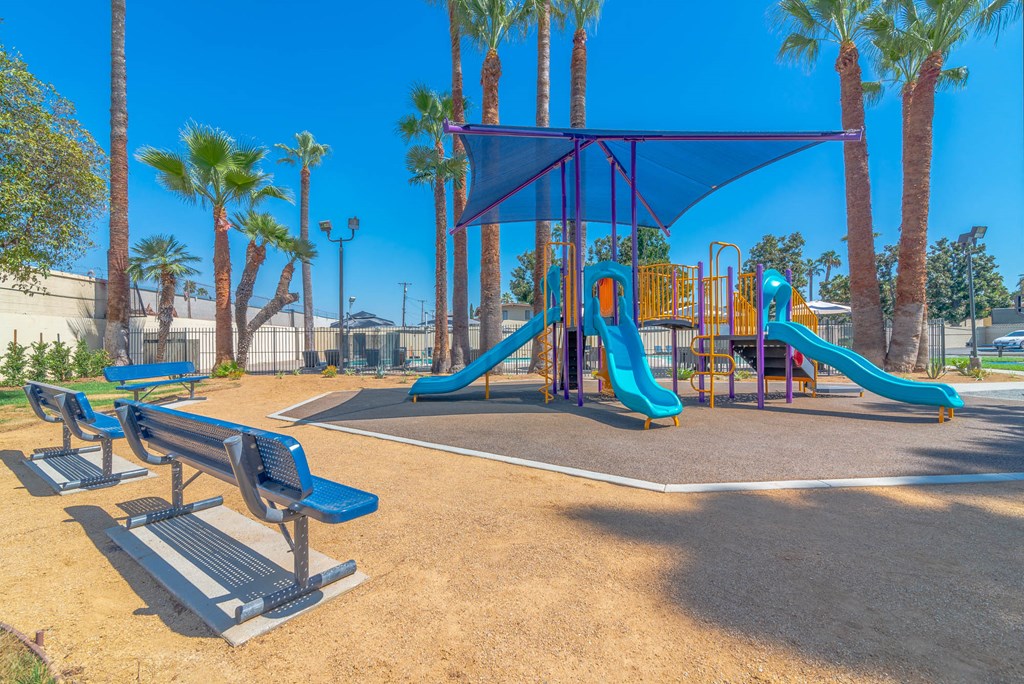 Playpark view with benches at Serrano Apartments, California, 91790