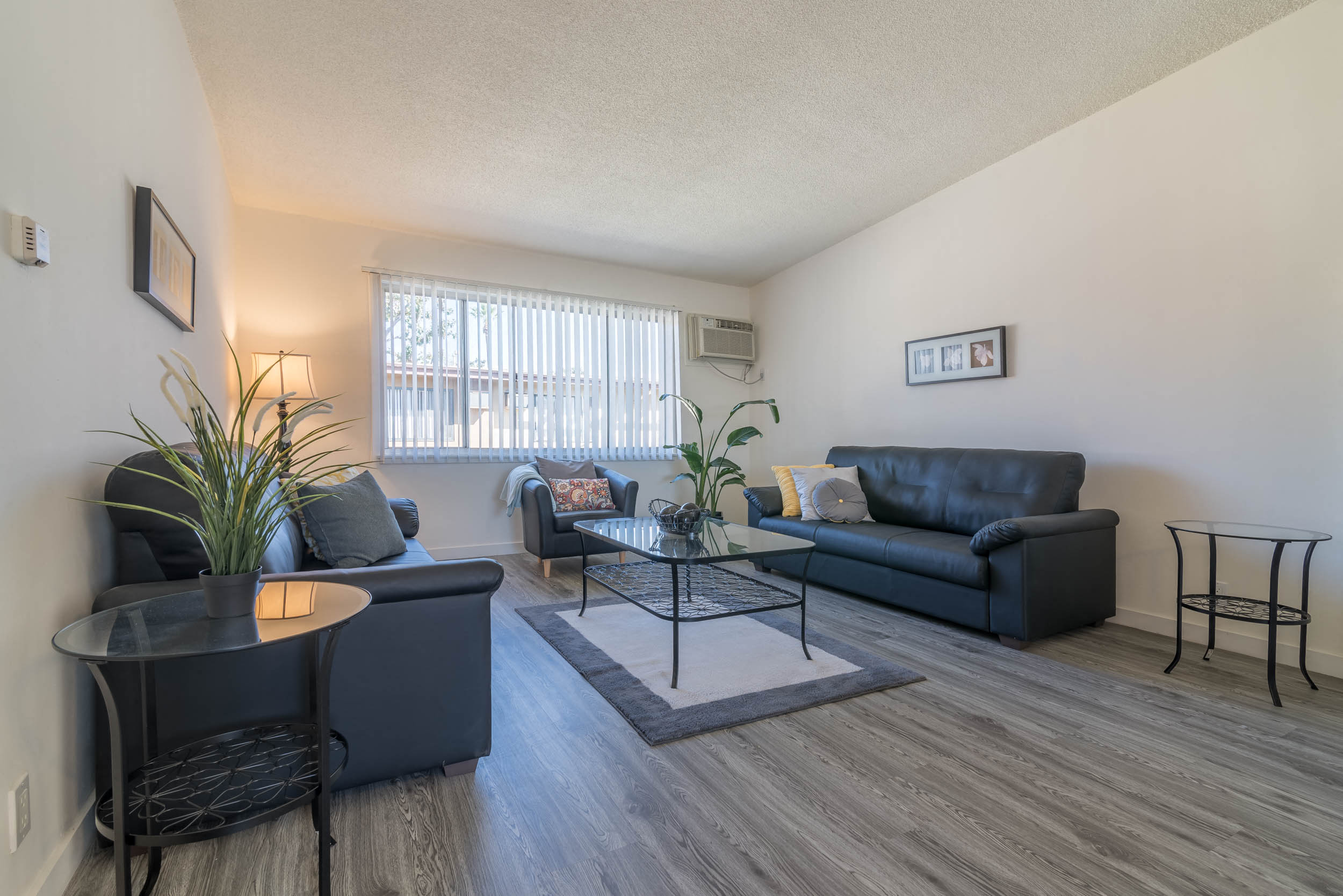 living room view at Serrano Apartments, West Covina, CA